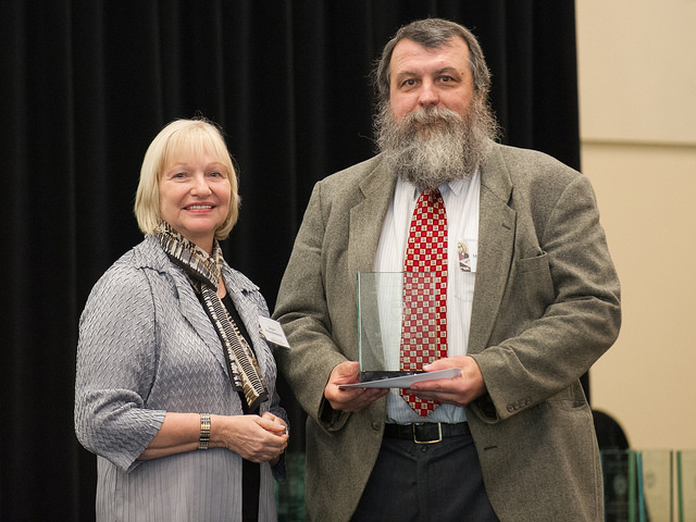 <span style="font-size:10px"> Dr. Rodgers receives his award</span>